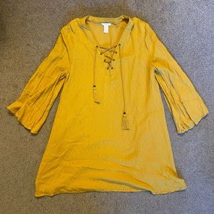 Mustard color, has subtle pattern